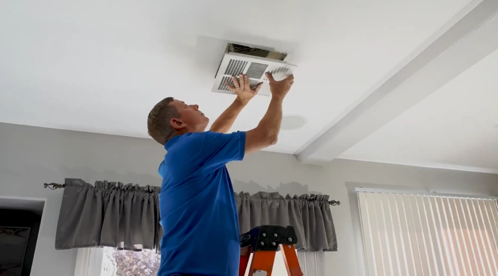 Tampa Air Duct Cleaners technician performing residential air duct cleaning in Tampa, FL