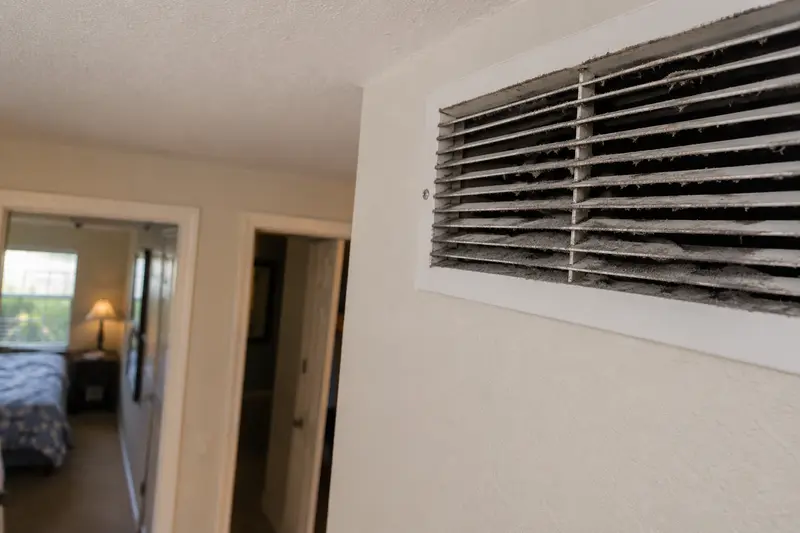 Dirty air vent showing visible dust buildup, a sign of needing duct cleaning