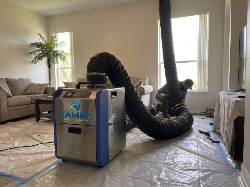 Negative-air vacuum extraction during a duct cleaning job in Tampa